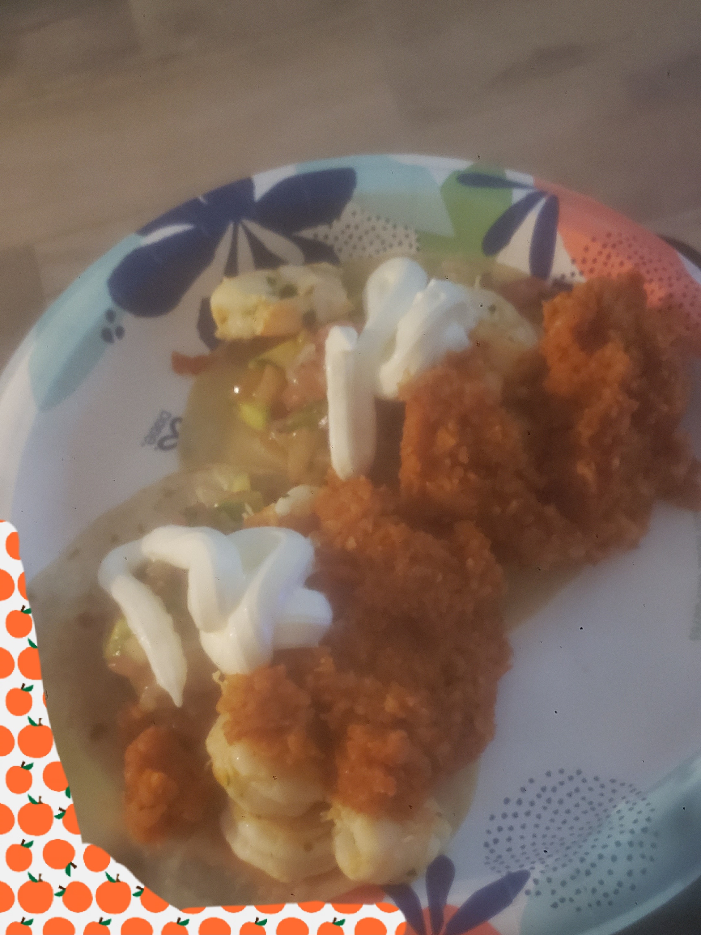 Shrimp tacos on a paper plate.